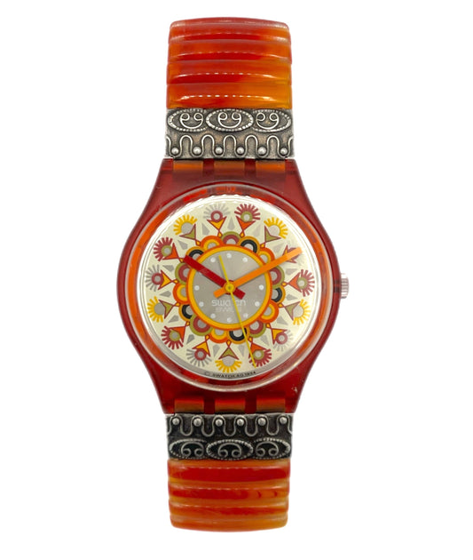 Wristwatch with decorative face and band on a white background