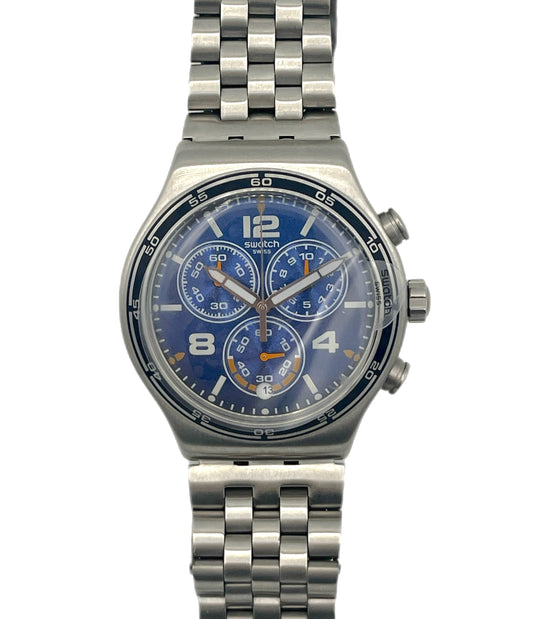 Swatch watch with blue face and silver metal strap on a white background