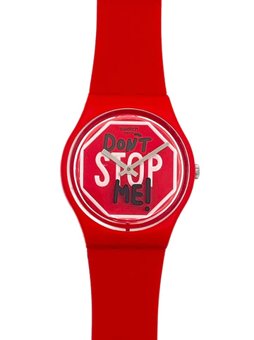 A red silicone watch with a round dial featuring the text 'Don't Stop Me!' in white and black on a red stop-sign motif, shown against a plain white background.