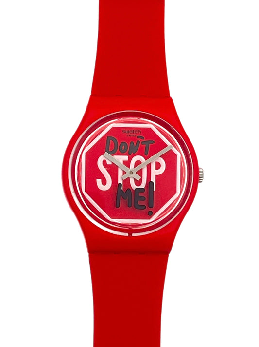 A red silicone watch with a round dial featuring the text 'Don't Stop Me!' in white and black on a red stop-sign motif, shown against a plain white background.
