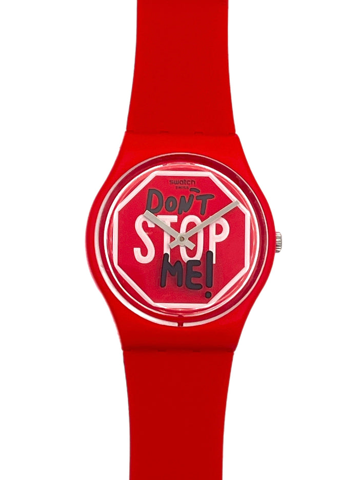 A red silicone watch with a round dial featuring the text 'Don't Stop Me!' in white and black on a red stop-sign motif, shown against a plain white background.