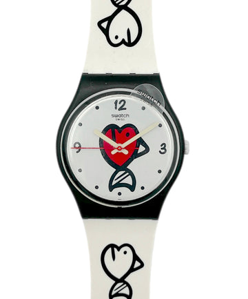Swatch watch with a white strap and black and red design on the dial against a white background
