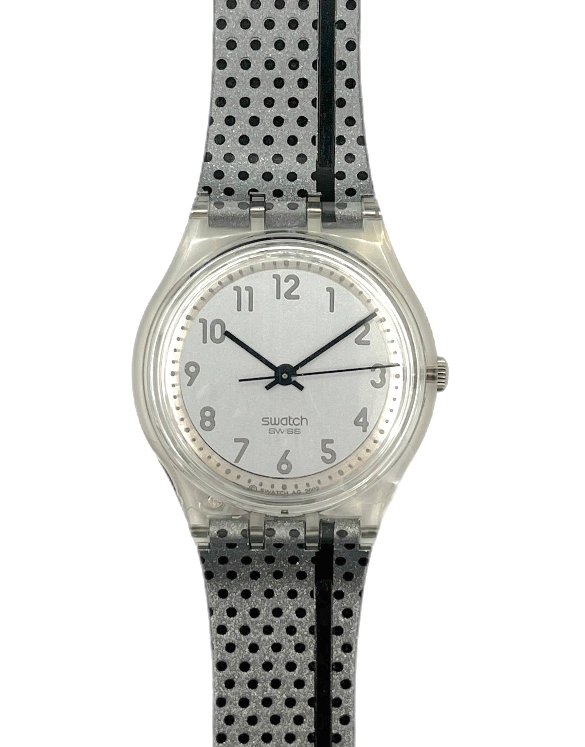 Swatch watch with a black and white polka dot strap on a white background