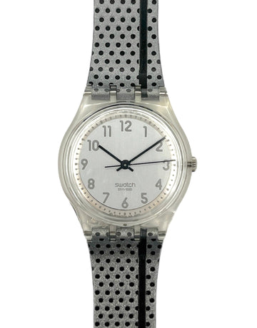 Swatch watch with a black and white polka dot strap on a white background