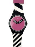 Swatch wristwatch with a black case, pink dial, and a black-and-white striped silicone strap, featuring the words 'WHAT EVER' on the dial.