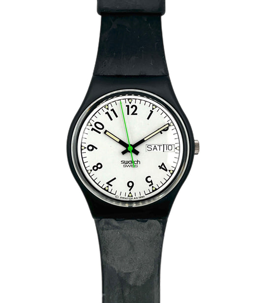 Black wristwatch with a white face displaying the brand 'Swatch'.