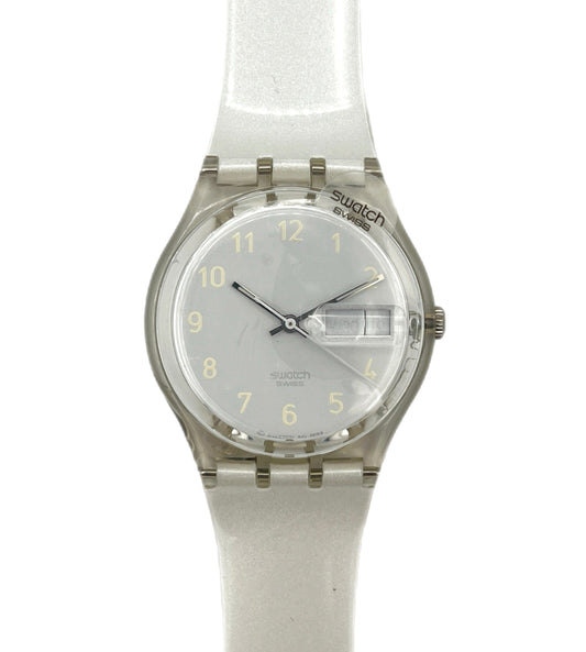 Swatch watch with a clear strap on a white background
