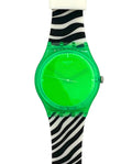 A Swatch wristwatch featuring a translucent neon green case and dial, paired with a black and white zebra print strap.