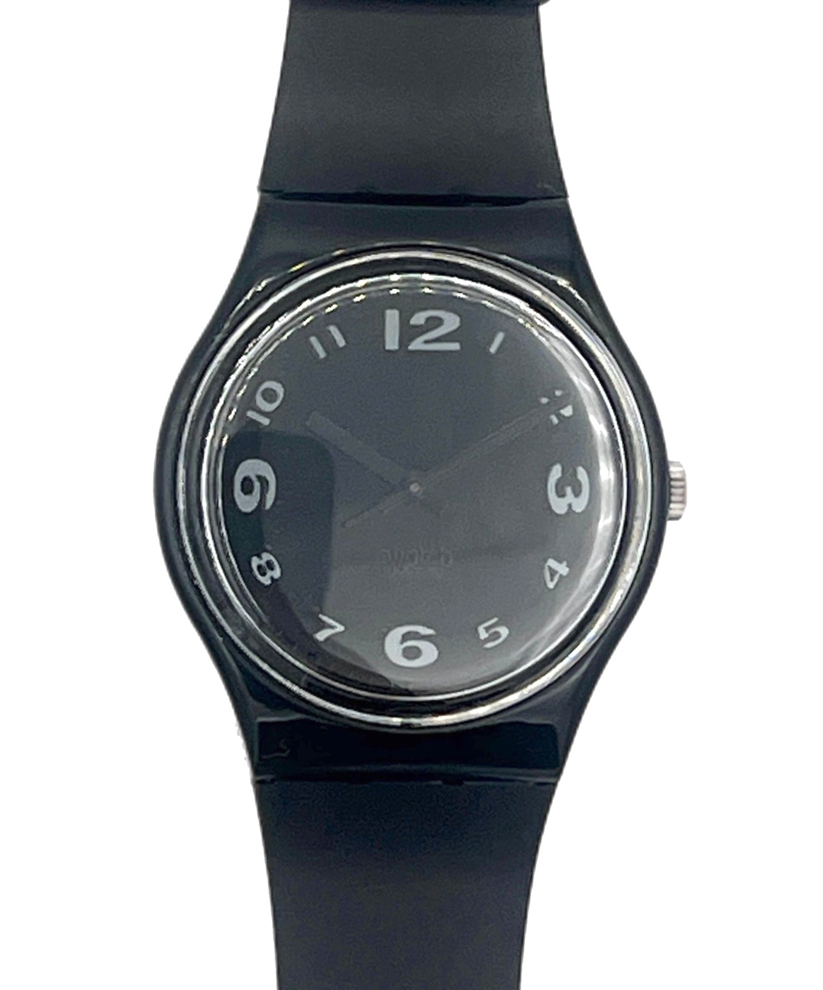 A Swatch wristwatch with a black silicone strap, black dial, and silver-tone bezel, shown against a plain white background.