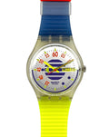 A Swatch analog wristwatch with a translucent strap featuring a red top section, a blue upper section, and a bright neon yellow lower section. The watch has a clear case and a white dial with colorful markings.