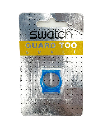 Swatch Guard Too Small blue ring accessory in its original silver blister packaging with a yellow brand label.