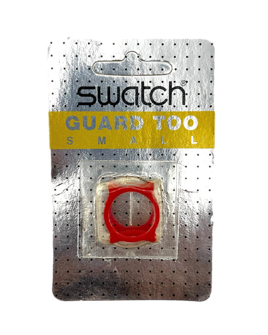 Swatch Guard Too Small red ring accessory in its original blister card packaging, featuring a silver perforated backing with a yellow Swatch logo banner.