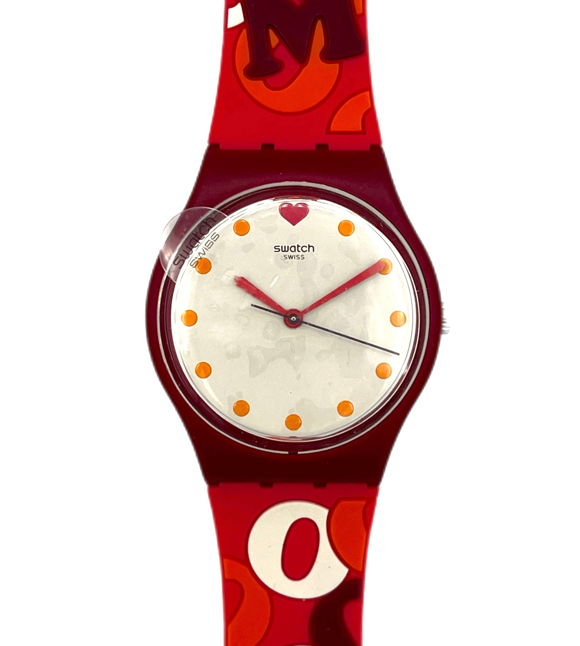 Red Swatch watch with white face and orange dots on a white background
