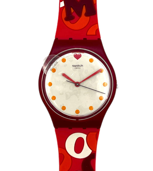 Red Swatch watch with white face and orange dots on a white background