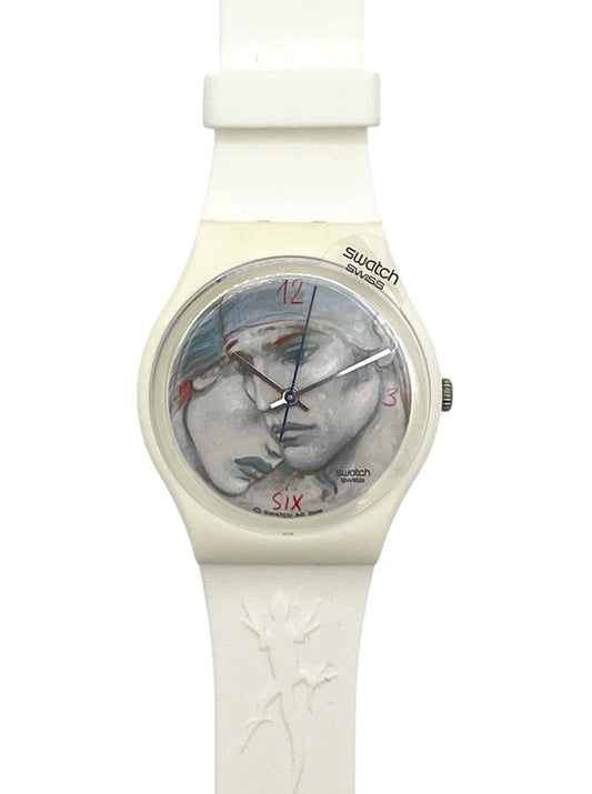 Swatch 5207 watch featuring a white silicone strap and case, with a dial displaying a stylized portrait of two faces.