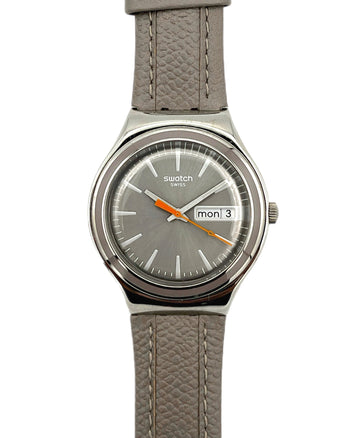 Gray Swatch watch with a gray strap on a white background