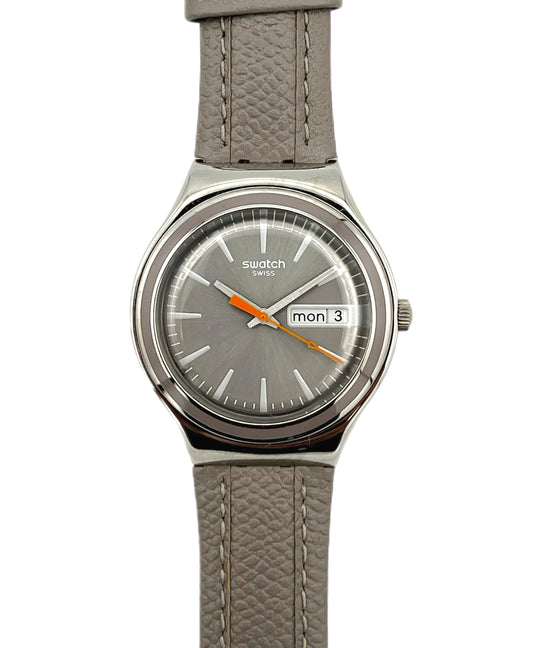 Gray Swatch watch with a gray strap on a white background