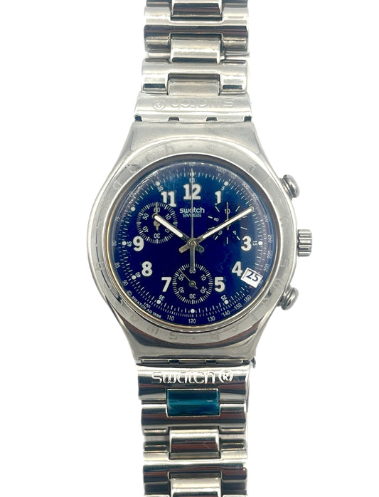 Silver Swatch watch with blue face on a white background