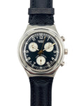 Swatch watch with black strap and blue dial on a white background