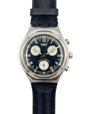 Swatch watch with black strap and blue dial on a white background