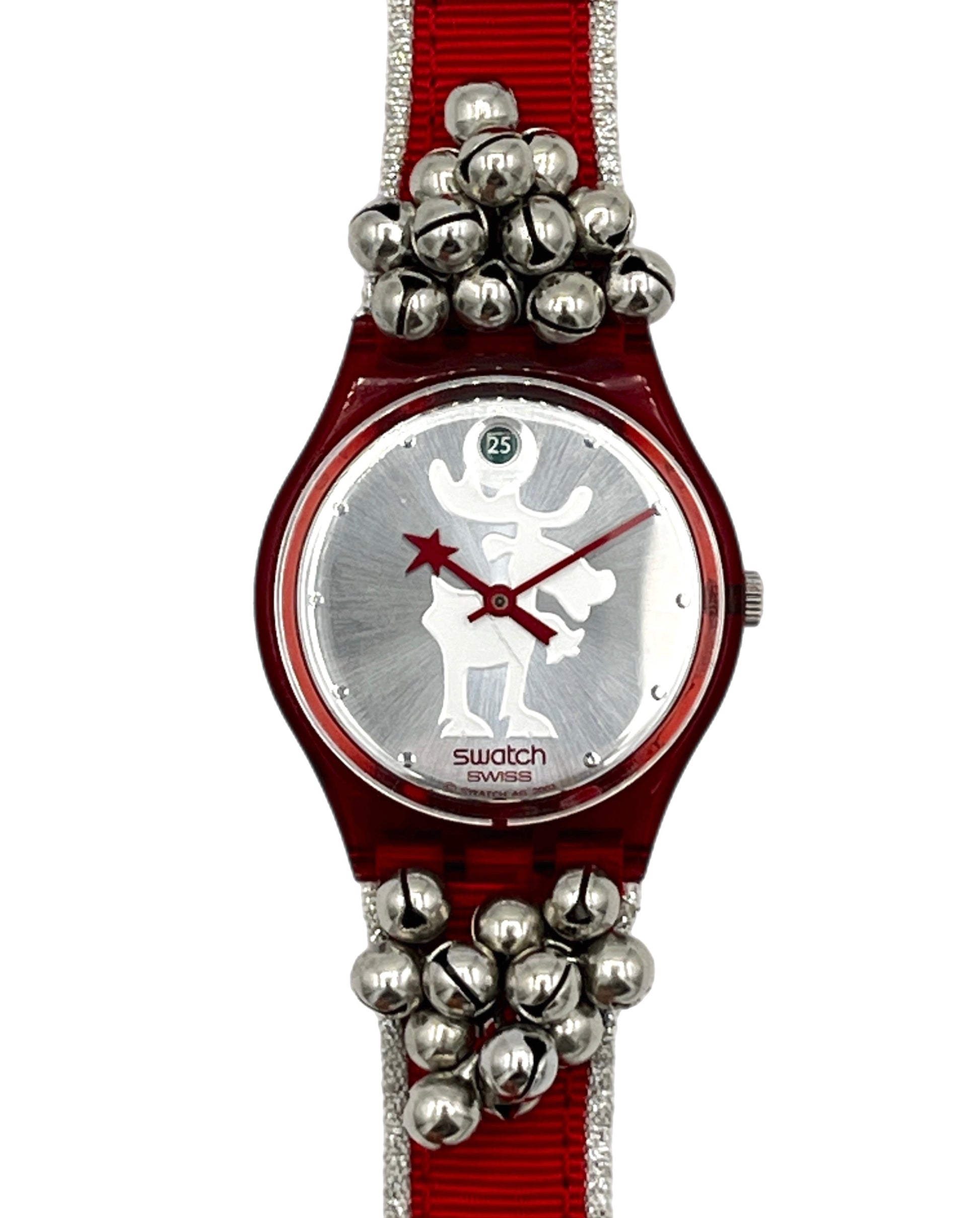 Swatch wristwatch with a red fabric strap, silver bell embellishments, and a silver dial featuring a white reindeer silhouette.