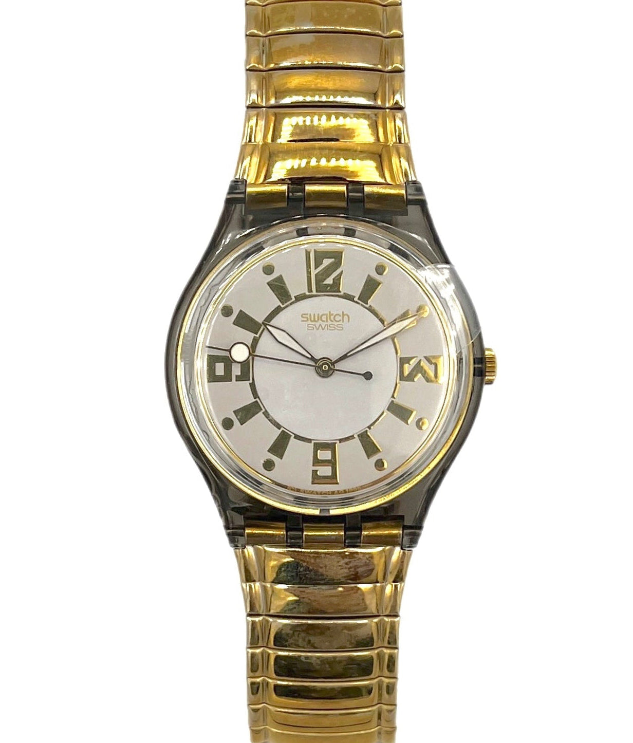 Gold wristwatch with a white face on a white background
