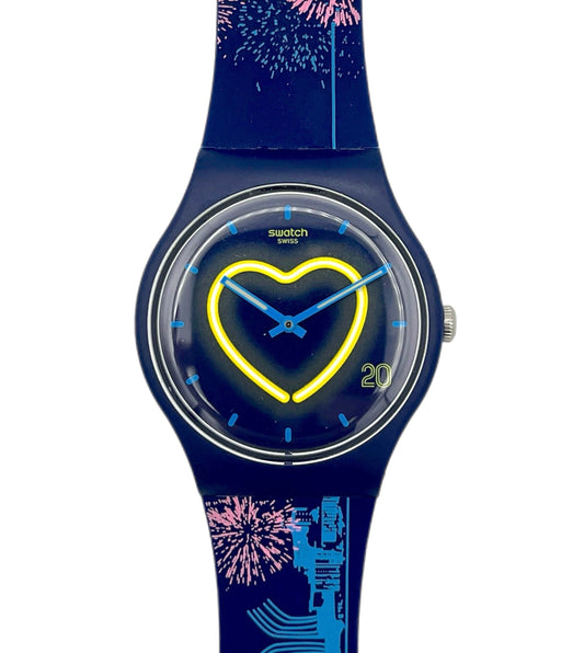 Navy blue Swatch watch with heart design on a white background
