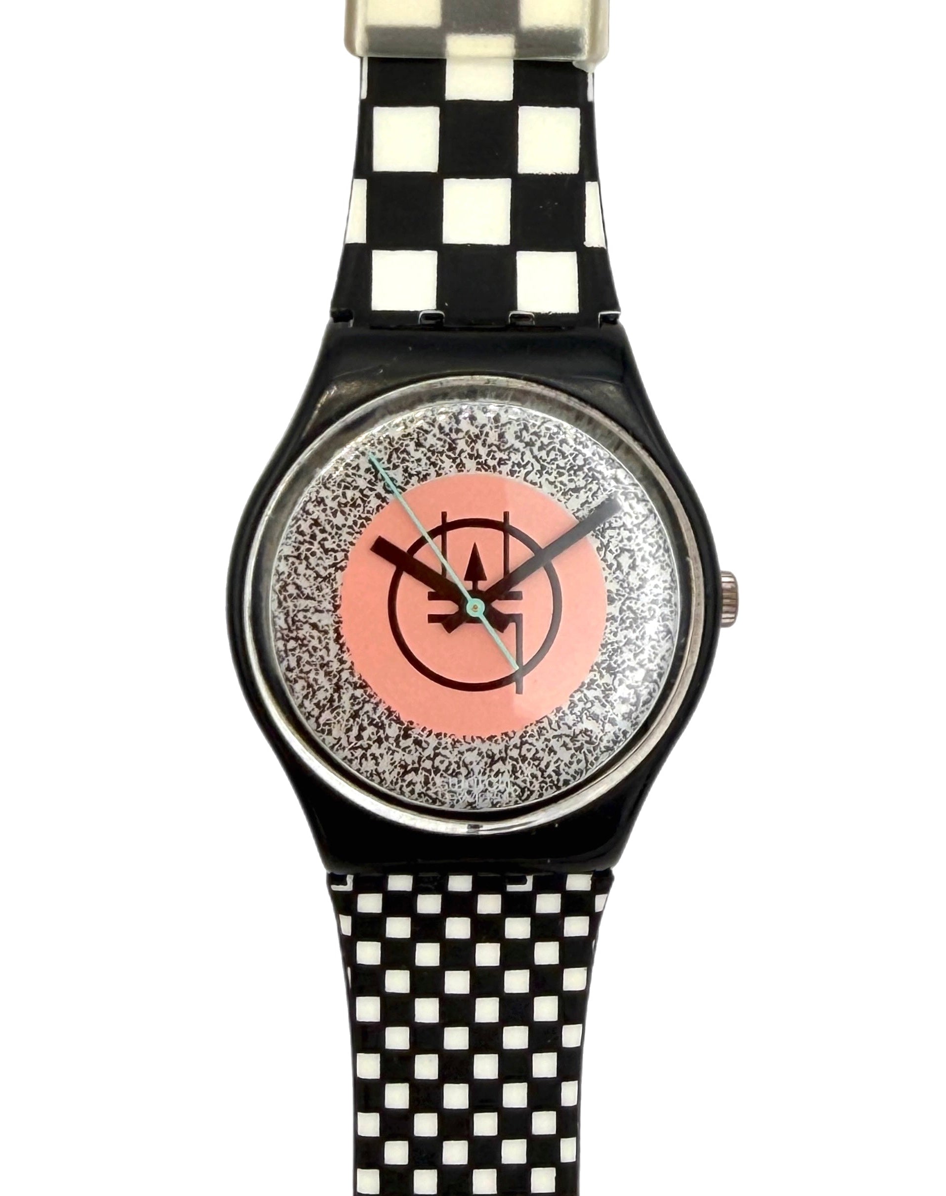 A wristwatch with a black and white checkered strap, a black case, and a glittery silver dial featuring a pink center circle with a black logo.
