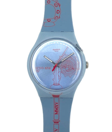 Swatch watch with blue strap and red text on a white background