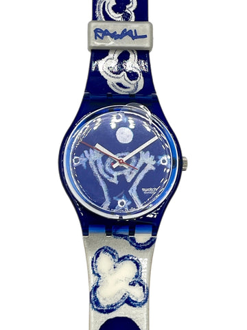 Blue watch with floral design on a white background