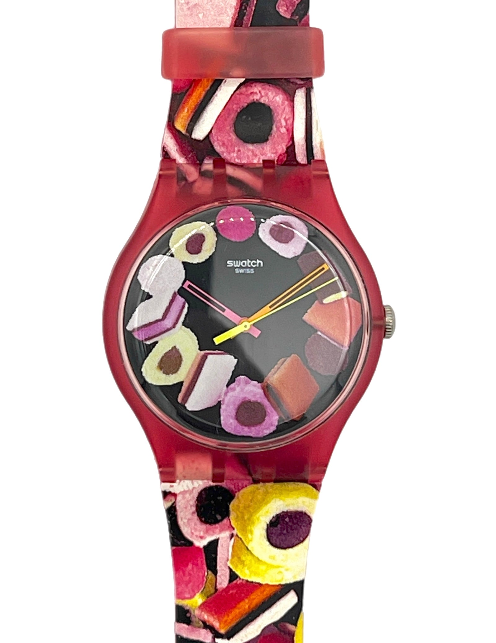 Swatch wristwatch with a translucent red case and a colorful candy-themed strap and dial, shown on a plain white background.