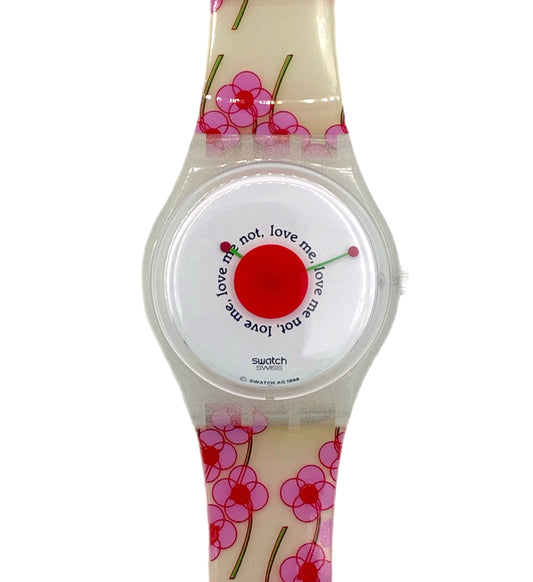 Watch with floral strap and red heart design on a white background