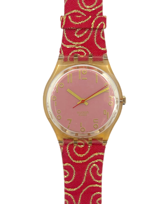 Wristwatch with red strap and pink face on a white background
