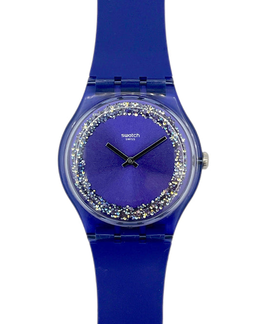 Purple Swatch watch with decorative face on a white background