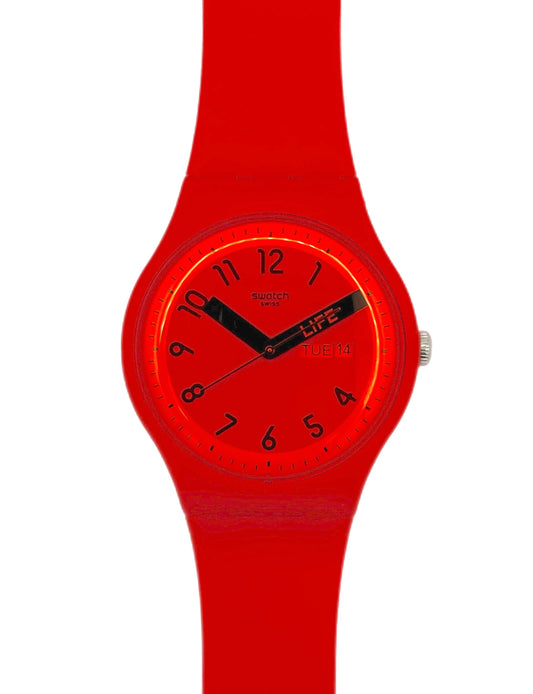 Red wristwatch with a white background
