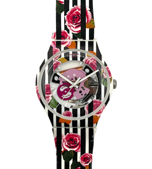 Watch with floral and striped strap on a white background