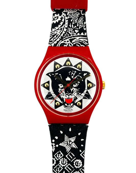Watch with a red and black bandana-themed strap and a black panther design on the face.
