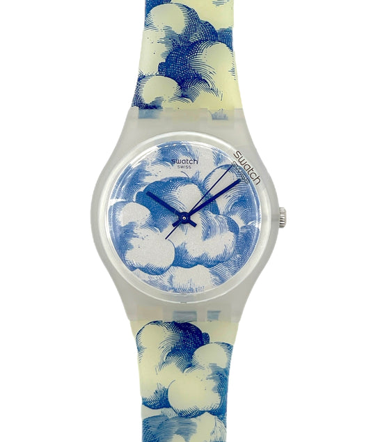 Swatch watch with blue and white cloud pattern on a white background