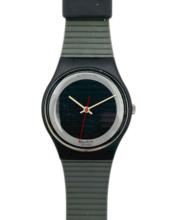 Swatch watch with black strap and black dial on a white background