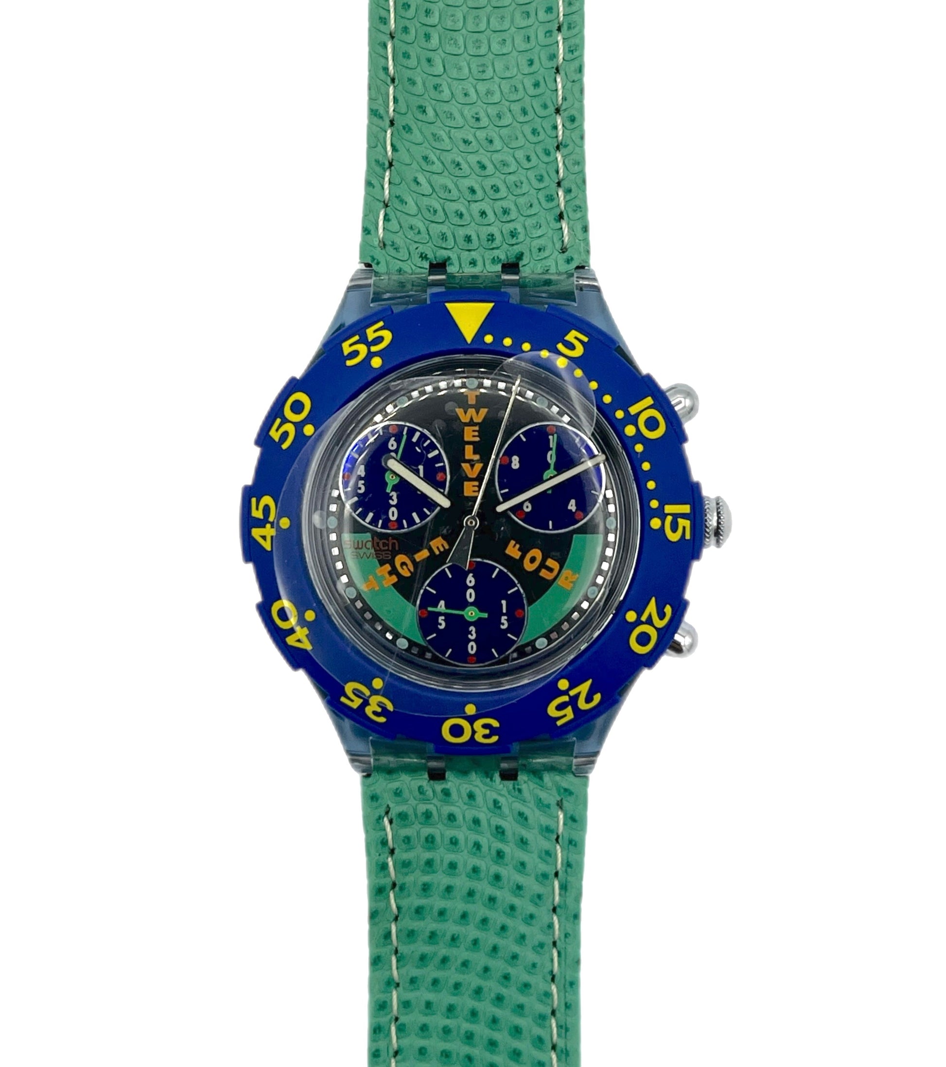 Wristwatch with blue case and green strap on a white background
