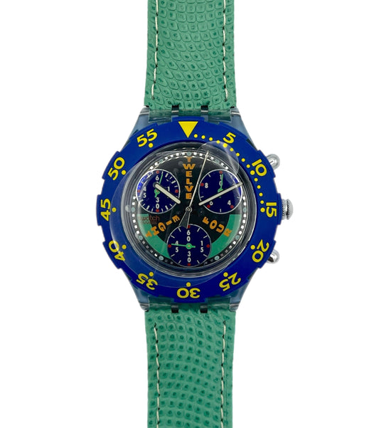 Wristwatch with blue case and green strap on a white background