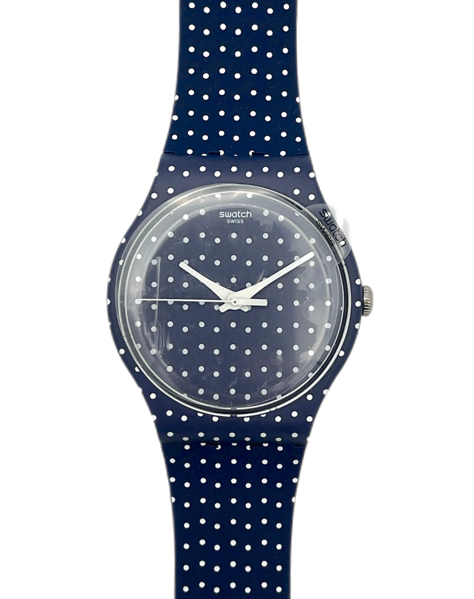 Swatch watch with navy blue polka dot strap on a white background