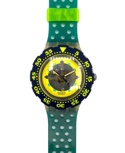 Swatch watch with green strap and yellow face on a white background