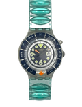 A Swatch wristwatch featuring a translucent aqua green silicone link strap and a dark blue bezel with a matching dial, shown against a plain white background.