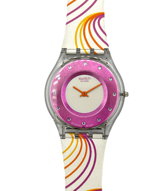 Swatch watch with a colorful strap and pink dial on a white background