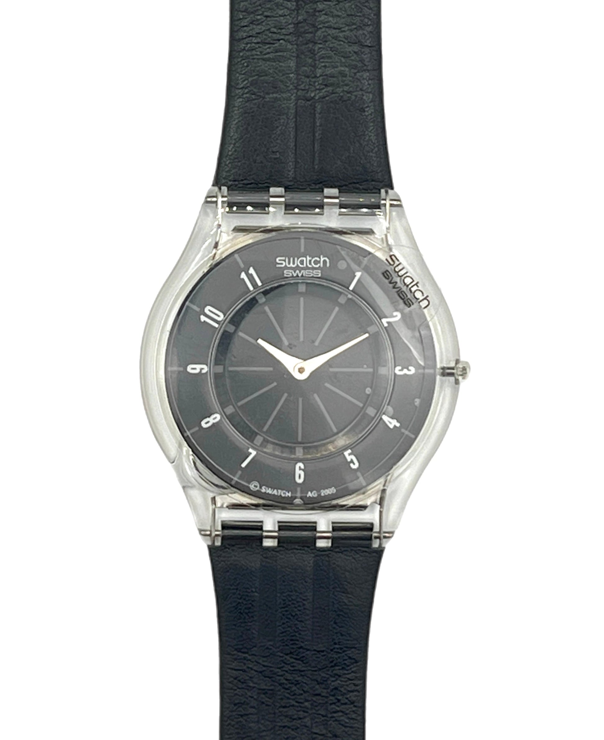 Swatch Swatch Explorer wristwatch with a black textured leather strap, clear crystal case, and black dial with white numerals and hands.