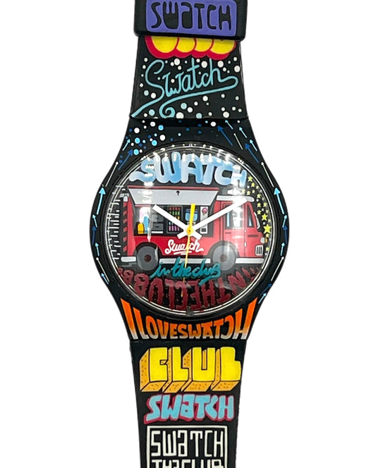 A Swatch brand wristwatch with a black strap and case decorated with colorful graffiti-style text and graphics, including 'I LOVE SWITCH', 'SWATCH', 'Club Swatch', and 'Swatch The Club'.