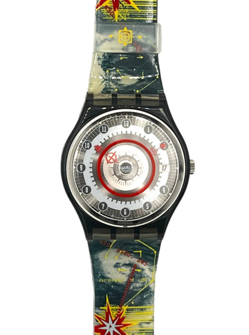 A Swatch wristwatch with a black case and a translucent strap featuring a colorful space-themed graphic print with stars, planets, and red starburst accents.