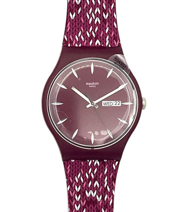 Swatch wristwatch with a burgundy round case, a matching burgundy dial with silver-tone hands and markers, and a textured knit strap in burgundy and white.