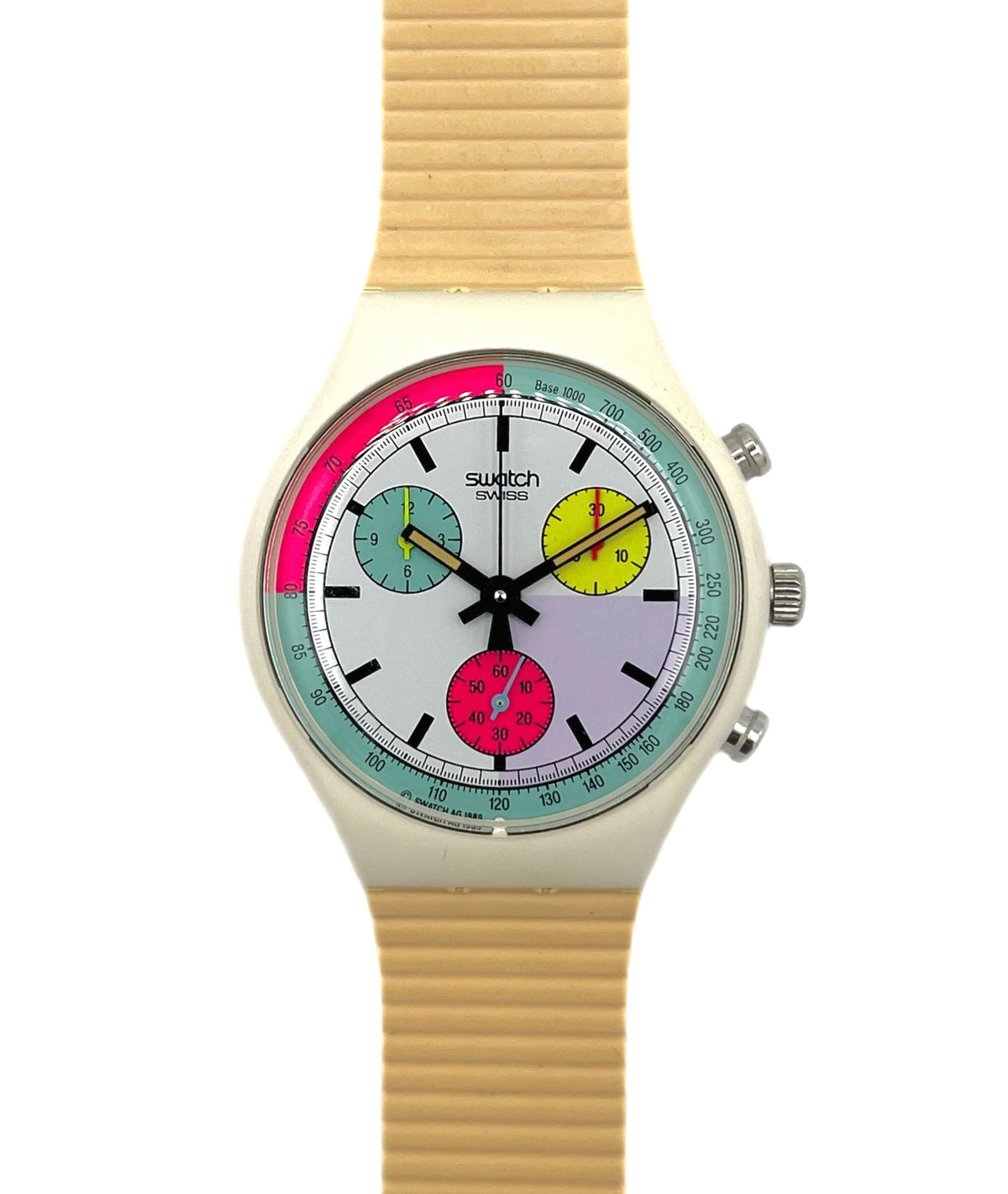 Swatch watch with a colorful face and beige strap on a white background